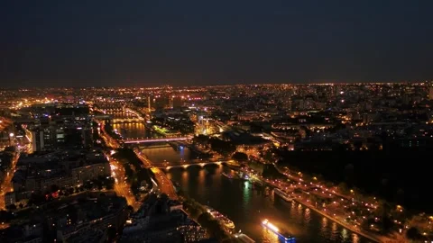 The city of Paris is built along a bend in the River Seine by Drone Stock Footage 243464885