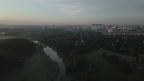 City park, the river flows. Shot at dawn, at sunrise. Aerial photography. Stock Footage 158737742