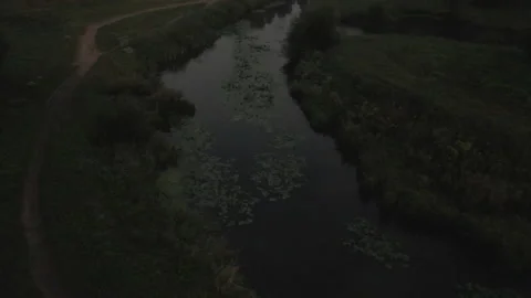 City park, the river flows. Shot at dawn, at sunrise. Aerial photography. Stock Footage 158738172