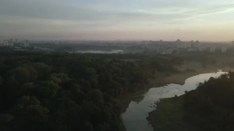 City park, the river flows. Shot at dawn, at sunrise. Aerial photography. Stock Footage 158738173