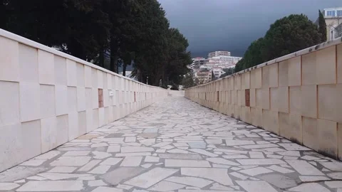 City pavement surrounded by high tiled curb for fencing Stock Footage 132028070