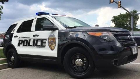 City police vehicle blocking intersection Beavercreek Ohio 스톡 동영상 77734985