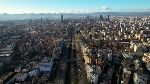 City river of Lana streaming through buildings in Tirana, new towers and Stock Footage 227266676