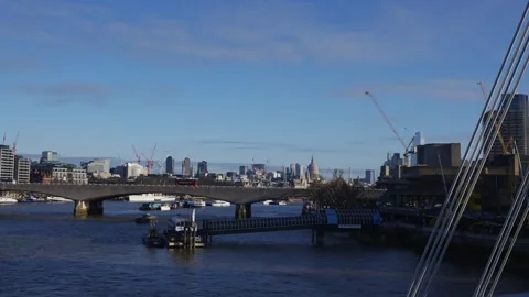 A city with a river running through it and a bridge over the water Video stock 297860164