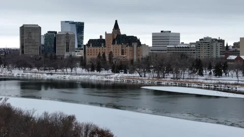 City with a river running through it and a large building in the background Stock Footage 301342875