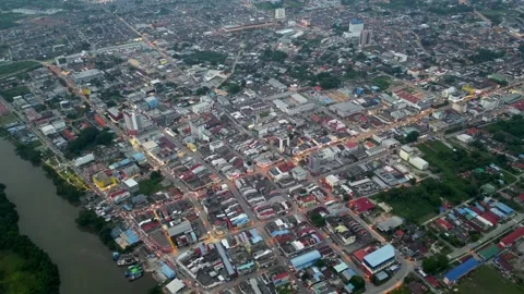 A city with a river running through it. Aerial Batu Pahat town in night Video stock 325831738