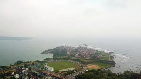 A city on a seashore...the sky is visible from the waves of the sea. Stock Footage 305523731