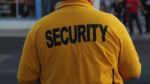 A city security guard from behind Stock Footage