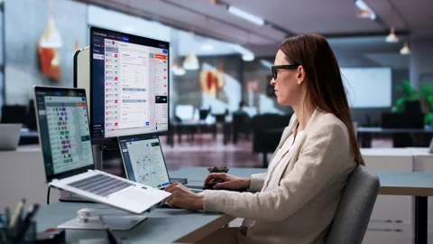 City Services Coordinator Using Software To Track Stock Footage 347904423