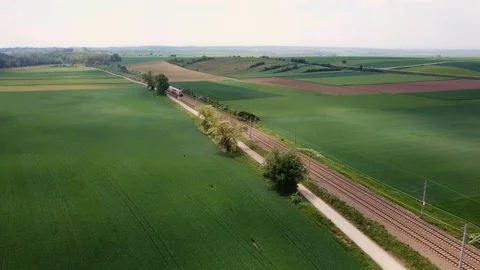 CITY SHUTTLE train in open fields  DRONE Train Stock Footage 108307204