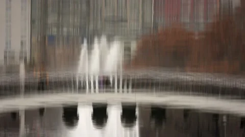 City silhouette reflected in park pool water Stock Footage 227573378