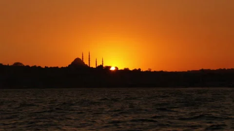 City silhouette with stunning orange sunset and dark shapes of landmarks Stock Footage 142742453