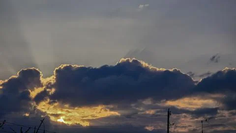 City sky with clouds, spring thunderstorms. Beautiful pink and orange clouds. Stock Photos