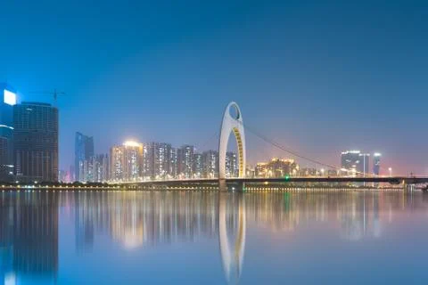 City skyline and reflection in guangzhou , beautiful pearl river new town at  Stock Photos