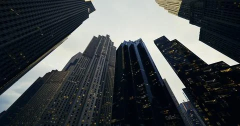 City skyline captured from below during twilight with glowing windows Stock Illustration