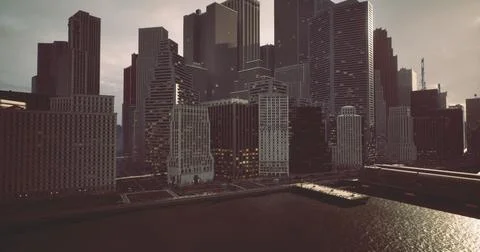 City skyline during twilight with reflections on water near buildings Ilustración de archivo