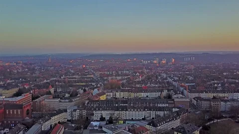 The city skyline of Essen during sunset, aerial Stock Footage