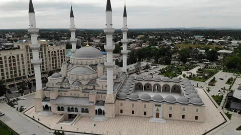 City Skyline Highlights Mosque Architecture. Aerial View Showcases Mosque Stock Footage 331585296