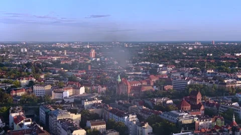 City skyline with large fire smoke plume rising. Lovely aerial view drone Stock Footage 345336956