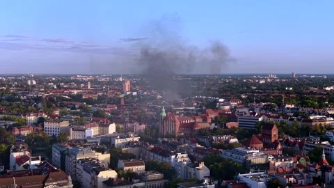 City skyline with large fire smoke plume rising. Unique aerial view drone Stock Footage 345337003