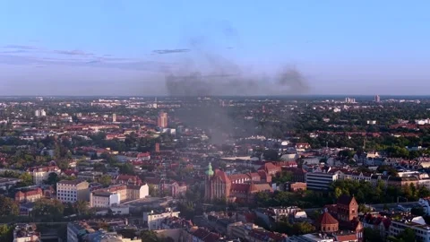 City skyline with large fire smoke plume rising. Amazing aerial view drone Stock Footage 345337020