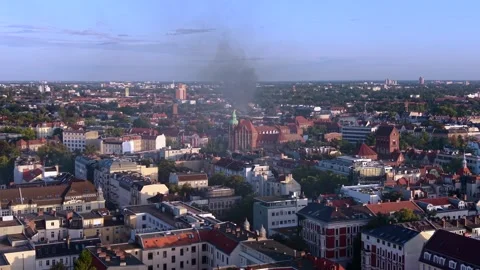 City skyline with large fire smoke plume rising. Magic aerial view drone Stock Footage 345337189