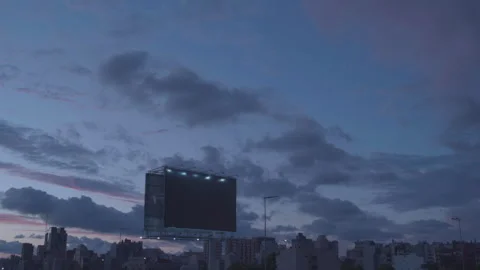City Skyline at Sunset with Empty Billboard and Moving Clouds Time-lapse Video stock 291678905