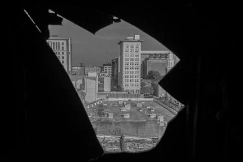 A City Skyline Through a Sharp Hole in a Wall Stock Photos