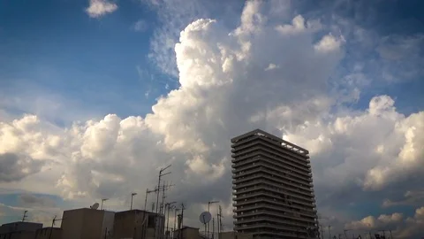 City skyline tower moving clouds in blue sky Stock Footage 92753324
