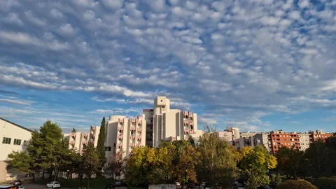 City skyline under beautiful clouds in the sky: panning time-lapse cityscape. Stock Footage 218988685