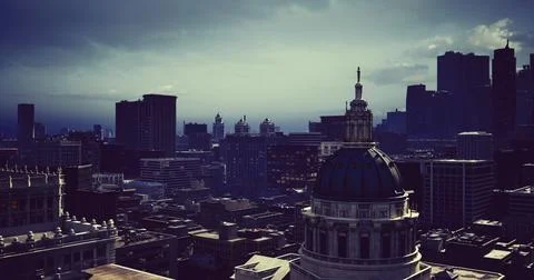 City skyline under dramatic sky with tall buildings and vibrant architecture Stock Illustration