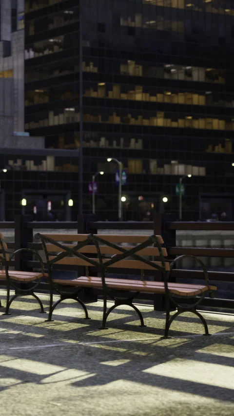 City street at night with empty bench and office buildings in background Vídeos de archivo 331682575