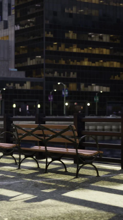 City street at night with empty bench and office buildings in background Vídeos de archivo 335452599