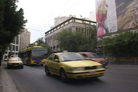 City street traffic in modern Athens, Greece Stock Footage