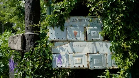 City streets. Old abandoned postboxes in a russian private residential area. 4K Stock-Footage 83421588