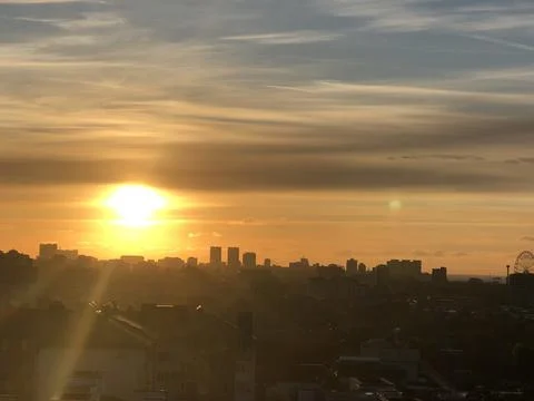City at sunset with clouds Stock-Fotos