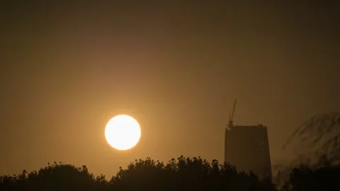 City Sunset Silhouette with Dramatic Sky and Urban Skyline Time-lapse Stock Footage 326704010