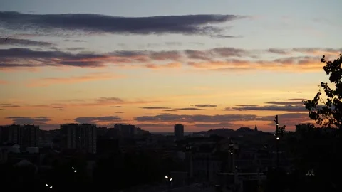 City Sunset Tranquility: Transition from Orange Dusk to Night Stock Footage 261236504