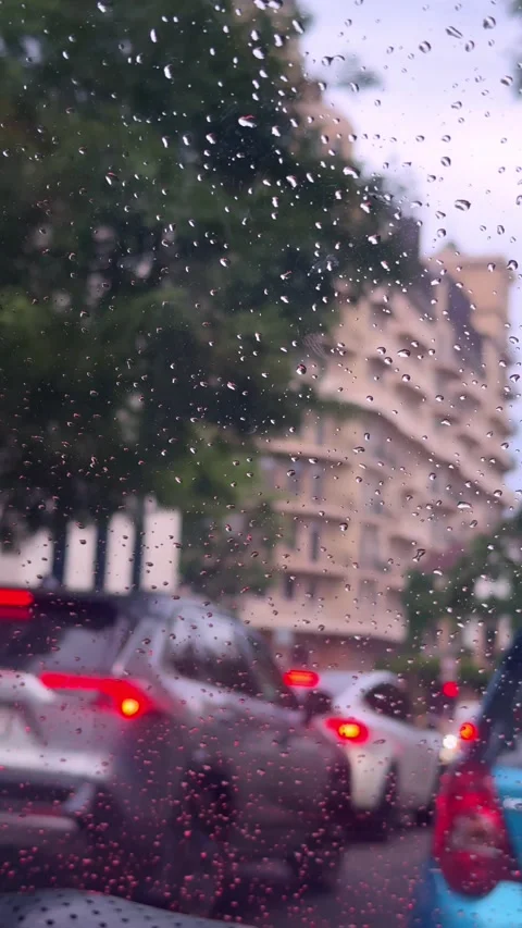 City Traffic Jam in Rain Viewed Through Car Windshield Vertical Stock Footage 345154637