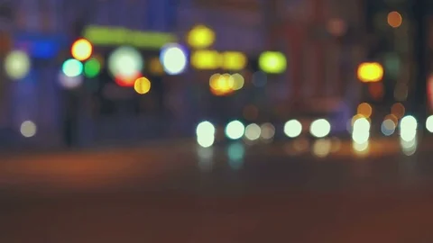 City traffic at night. Defocused shot. 4K Stock Footage 77074853