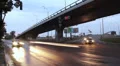 City traffic road junction, bridge highway, car lights turned on HD Footage
