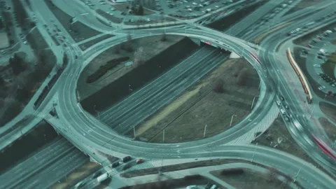 City traffic in roundabout intersection. Traffic circle aerial hyperlapse Stock Footage 160497899
