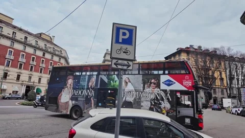 City traffic at roundabout with sightseeing bus excursions in Winter scene Stock Footage 327422977