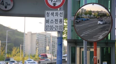 City traffic seen through a roadside mirror in Seoul Stock Footage 62586515