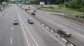 City traffic, three lanes each side road, cars drive daytime HD Footage