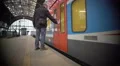 City train leaving railway platform, male passenger fails to board on time 4k or 4k+ Resolution