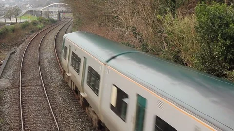 City Train passes beneath bridge POV, honks horn (with sound) Stock Footage 79694260