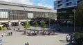 City tram arriving at Alexanderplatz, Berlin. People walking across the square HD Footage
