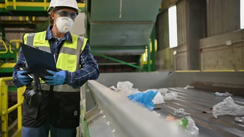 City Trash Sorting Facility Worker in His 40s Supervise Sorting Processes Stock Footage 219888468