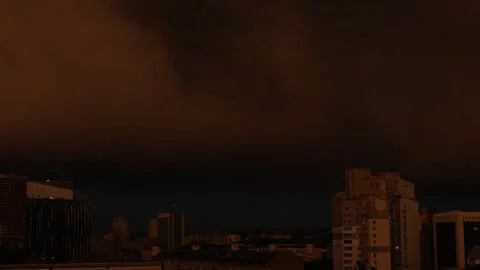 A city under an apocalyptic dramatic stormy red sky Stock Footage 337996009